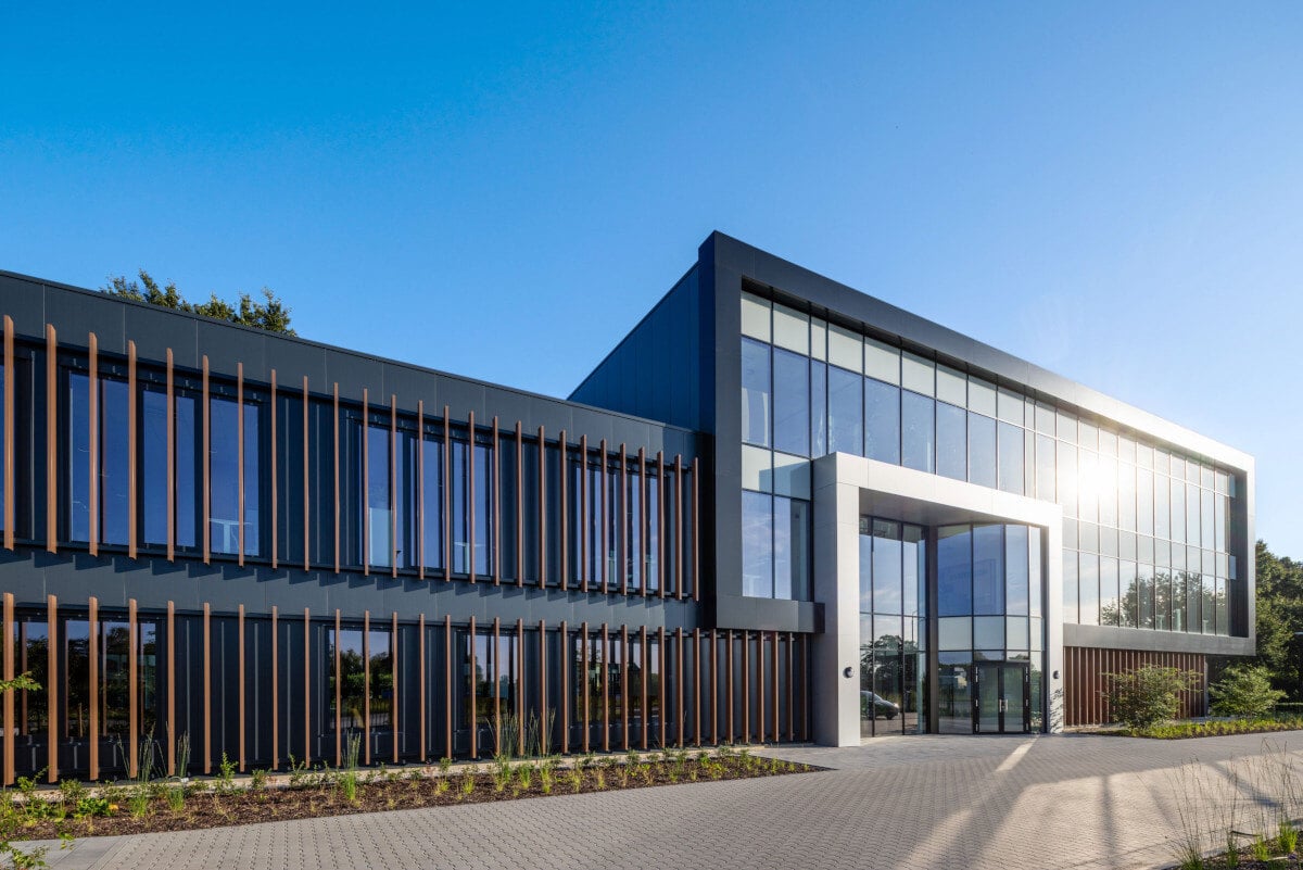 Modern office building at the Weert site with conference rooms and lounge areas.
